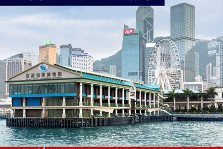 Hong Kong Maritime Museum as seen from the water.  Text reads:  Hong Kong - UK Shipping Forum: Managing Intervention in Global Shipping  Hong Kong Maritime Museum, Tuesday, 19th November, 2:30pm-7:30pm HKT